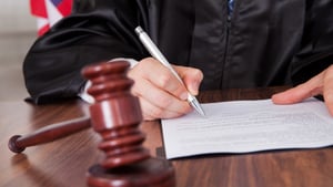 Judge-signing-papers2